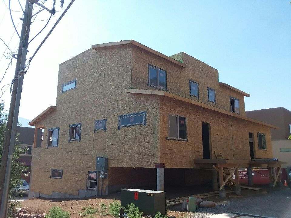 Aim Construction General Contractors - New Home Construction in Durango Colorado - Two Story Home in the Building Process with Framing